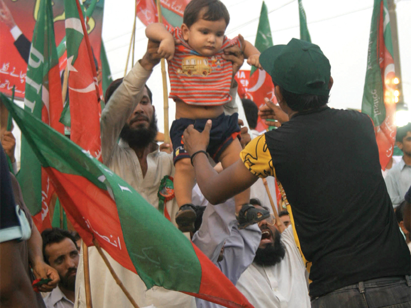 Waiting for Imran: PTI supporters beat the heat, sit the day out