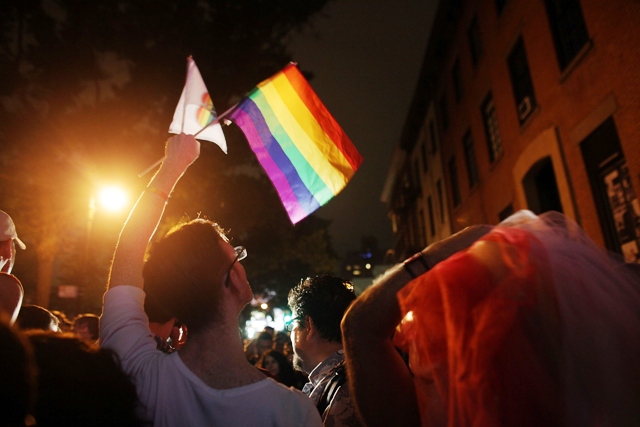 New York governor signs gay marriage into law