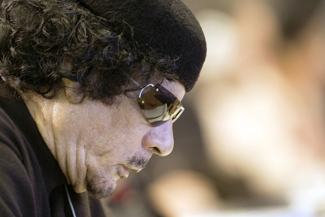 Qaddafi says he will not surrender