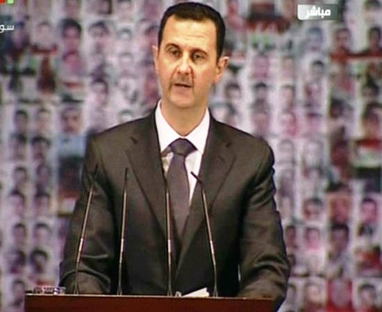 An image grab taken from the state-run Syrian TV shows Syria's embattled President Bashar al-Assad making a public address. PHOTO: AFP