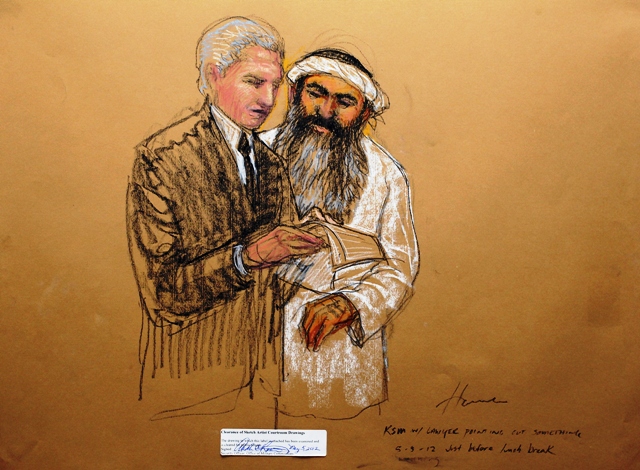 In this courtroom drawing reviewed and approved for release by a US military security official, Khalid Sheik Mohammed consults defense attorney civilian David Nevin during a break. PHOTO: AFP