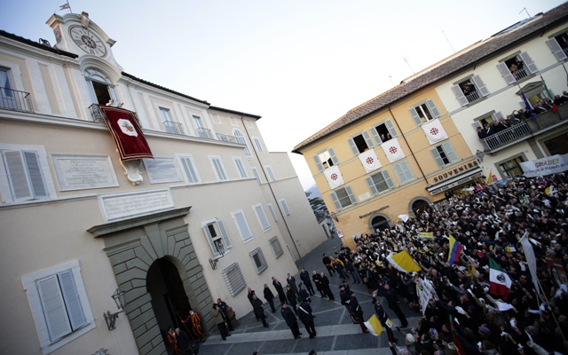 Pope Benedict XVI waves as he appears for the last time at the balcony of his summer residence in Castelgandolfo, south of Rome, February 28, 2013. PHOTO: REUTERS