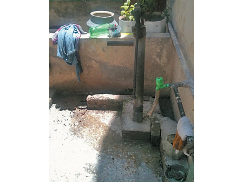 Over 40% of peri-urban households are not connected to tap water supply, and use pumps to draw water from shallow groundwater sources. PHOTO: SDPI