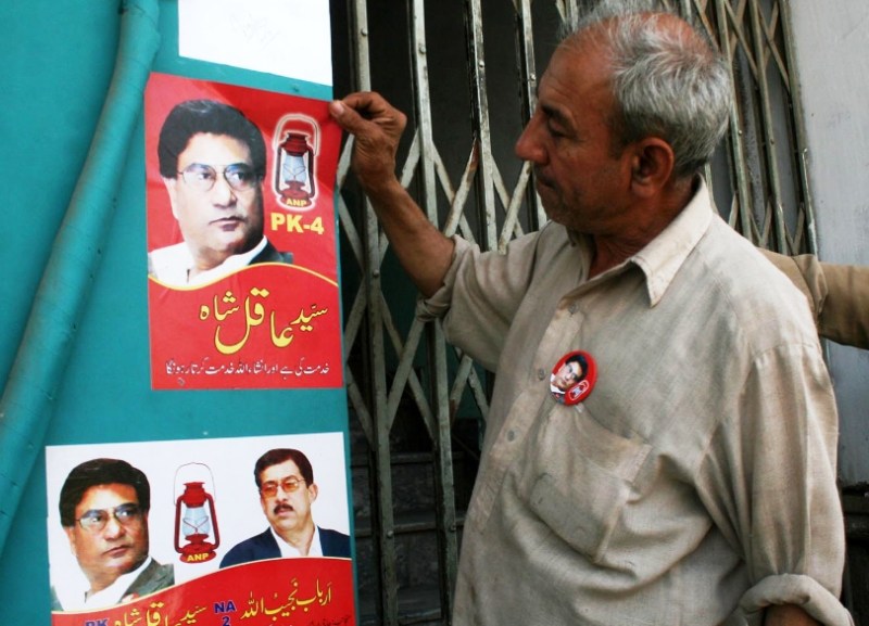 A handwritten letter in Pashtu ordered removal of party banners and flags.