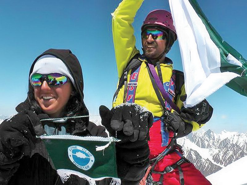 Samina, 21, besides a flagpost on Mount Everest, Nepal. PHOTO: EXPRESS