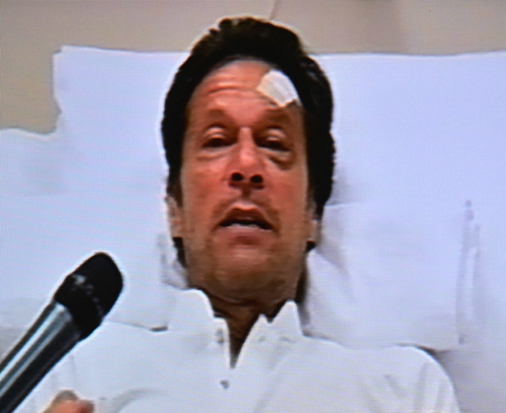 File photo of PTI chief Imran Khan speaking to the media from his hospital bed. PHOTO: AFP
