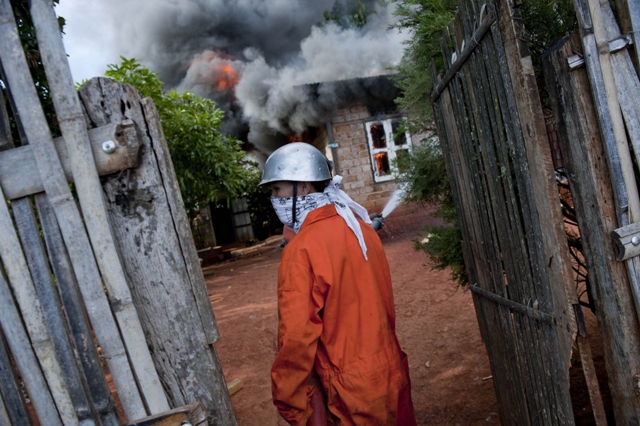 Firemen battle a fire in Lashio, Northern Shan state of Myanmar on May 29, 2013. PHOTO: AFP