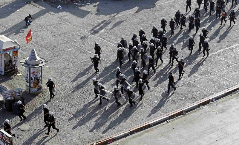 Turkish riot police secure the area during a protest at Taksim Square in Istanbul June 11, 2013. PHOTO: REUTERS