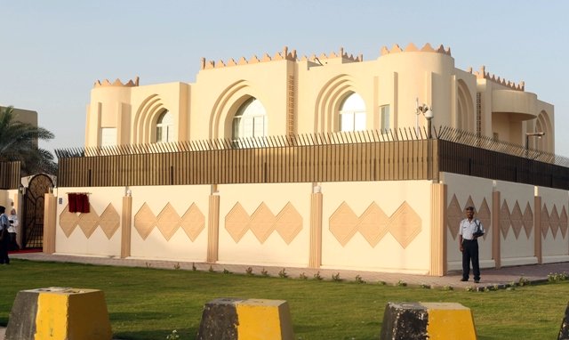 Security guards stand outside the new Taliban political office in Doha before the official opening on June 18, 2013. PHOTO: AFP