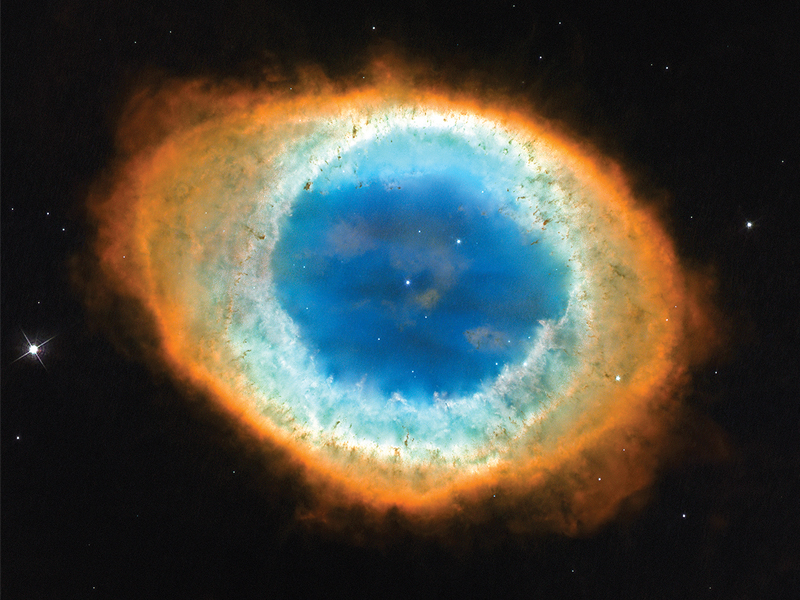 The Ring Nebula as captured by the Hubble Space Telescope. The whole structure in the photograph is about one light year across. SOURCE: NASA, ESA, AND THE HUBBLE HERITAGE (STSCI/AURA)-ESA/HUBBLE COLLABORATION