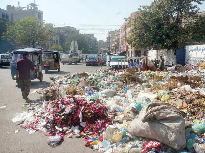 Heaps of garbage across the city are a common sight these days as KMC workers fail to get their salaries. The court has ordered the government to pay its grant to the municipality so workers can be paid before Eid. PHOTO: FILE