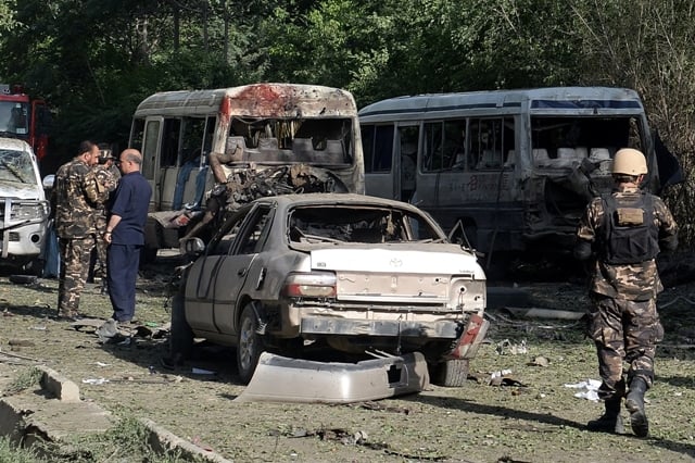 Afghan security personnel arrive at the site of a suicide attack in Kabul on June 11, 2013. PHOTO: AFP