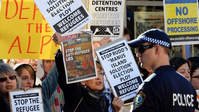 People protest against the Australian government's new policy of resettling refugees in Papua New Guinea, in Sydney on July 22, 2013. PHOTO: AFP
