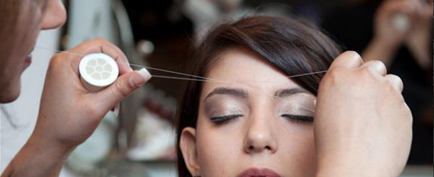 threading is a common way to shape eyebrows. PHOTO: AFP