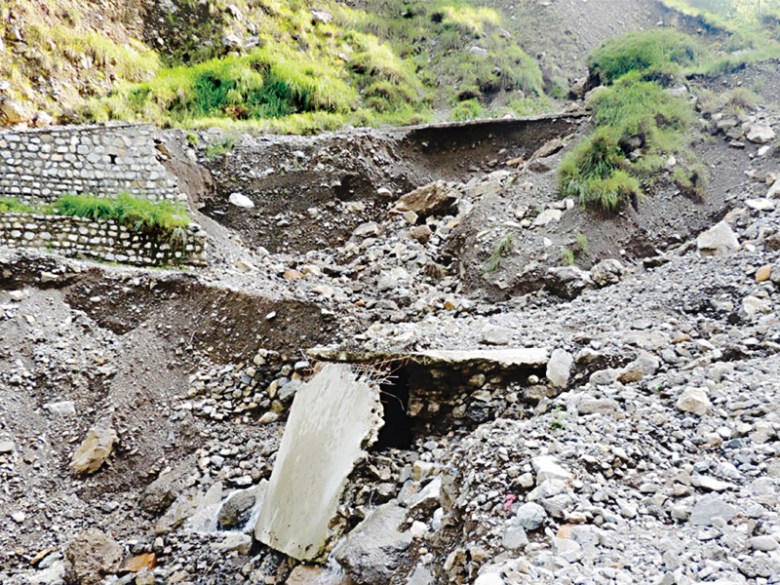 A view of the Chanala Noorbang Road in Abbottabad which was damaged after the recent spell of rains and subsequent landslides. PHOTO: NNI