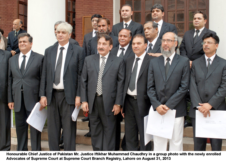 Chief Justice Iftikhar Muhammad Chudhry (3rd L front row) stands along side newly enrolled advocates at the Supreme Court registry in Lahore. PHOTO: APP