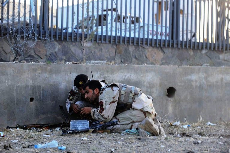 Security forces take position during an attack on US consulate in Herat, Afghanistan on September 13, 2013. PHOTO: AFP