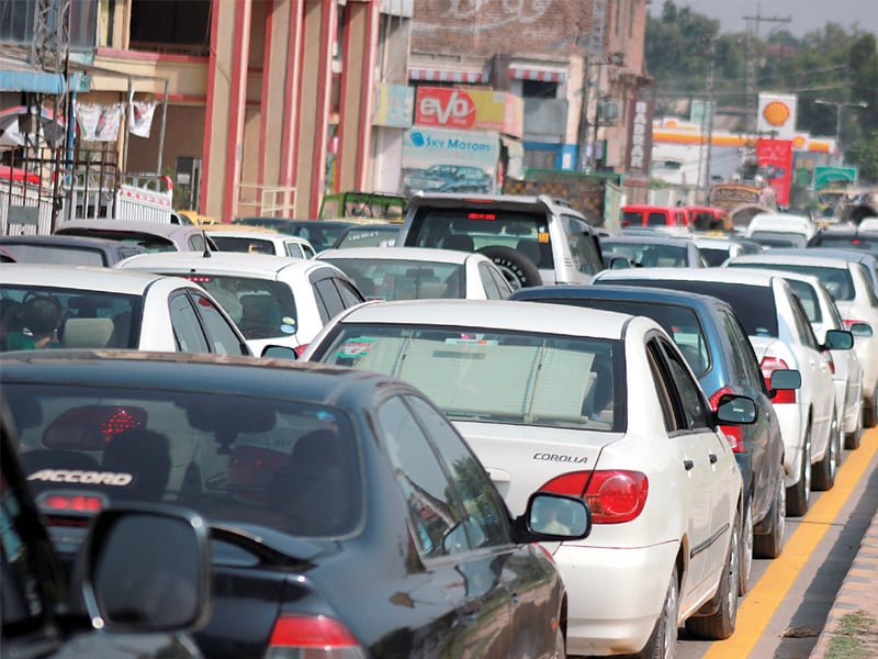 Traffic jam at Tehkal, University Road . PHOTO: MUHAMMAD IQBAL/EXPRESS
