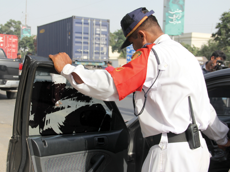 NGO CTAC, traffic police, Karachi police and the excise and taxation department held a rehearsal drive on Monday. Starting today, these officials will set up pickets across district South to check cars for their registration documents, standardised licence plates and clear windows. PHOTO: AYESHA MIR/EXPRESS