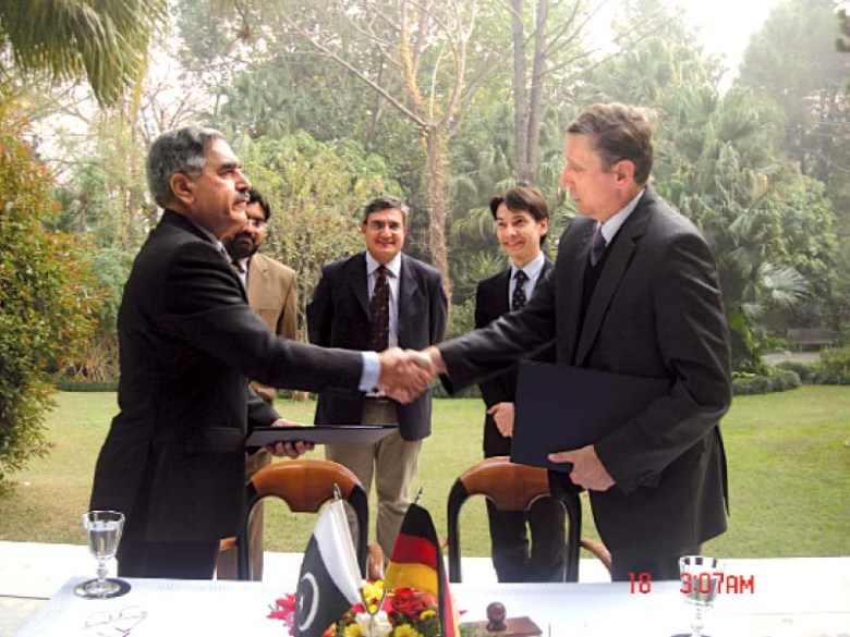 Ambassador Cyrill Nunn and HEC Chairperson Imtiaz Gilani shake hands after signing the agreement. PHOTO: EXPRESS