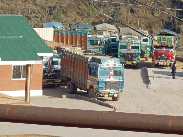 Indian goods trucks parked outside the office of Tata in Chokothi sector, AJK along the Line of Control. PHOTO: AFP