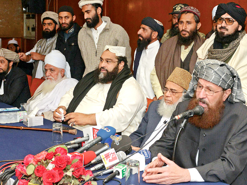 Maulana Samiul Haq briefs the media after Ulema and Mashaikh convention. PHOTO: AFP