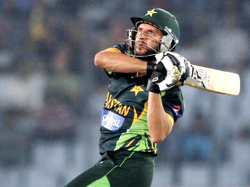 Shahid Afridi smashes a six against Bangladesh. PHOTO: REUTERS