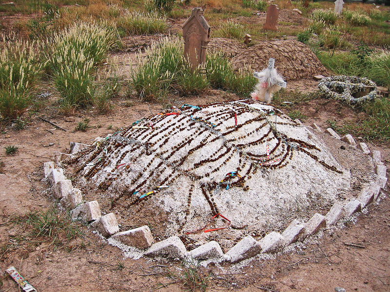 One of the relatively new graves in the cemetery. PHOTOS: RIAZ AHMAD