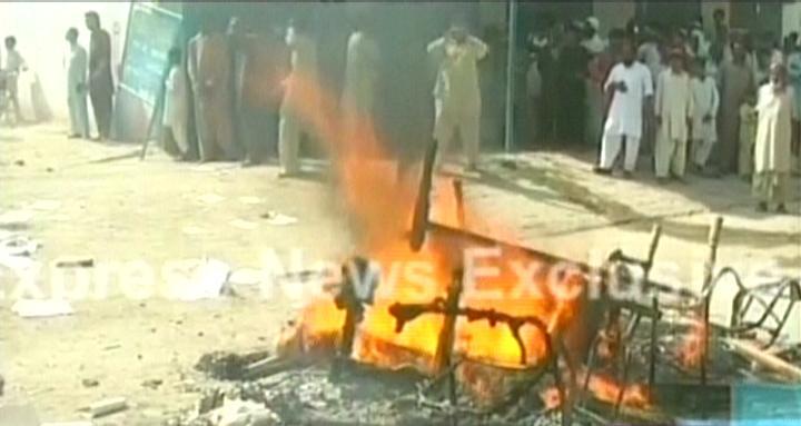 Express News screengrab shows property that was burnt by the protesting crowd outside one of the doctor's residence.