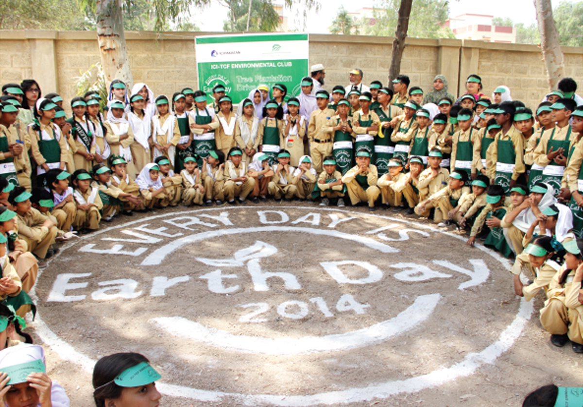 Green is the way: Students of The Citizens Foundation take a photograph after the plantation drive at the TCF Campus in Saeedabad to celebrate the annual Earth Day on April 22. A total of 55 trees were planted by the students and volunteers. PHOTO: PRESS RELEASE