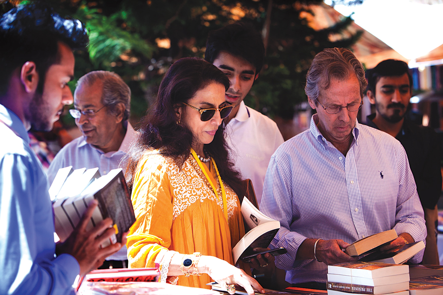 Shobhaa De goes through books at one of the stalls. PHOTO: MYRA IQBAL/EXPRESS