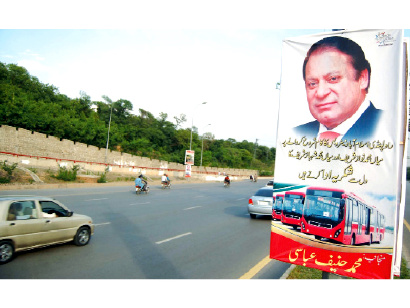 A streamer on a road-side by a PML-N politician appreciating the metro bus initiative. PHOTO: MUHAMMAD JAVAID/EXPRESS