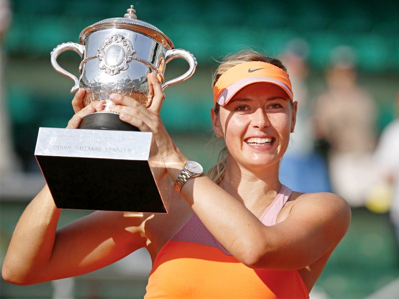 Maria Sharapova won the French Open for the second time in her career, her fifth grand slam which brings her level with Martina Hingis on the all-time list. PHOTO: AFP