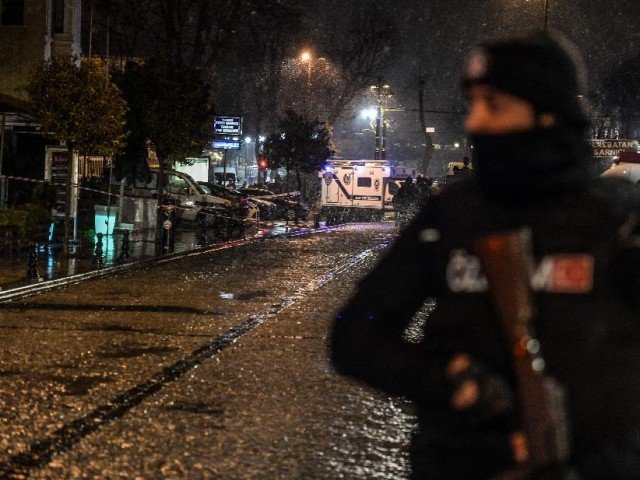 A Turkish police officer stands guard along a street leading to where a female suicide bomber was killed on January 6, 2015, when she blew herself up in an attack on the police station in the main tourist district of Istanbul PHOTO: AFP