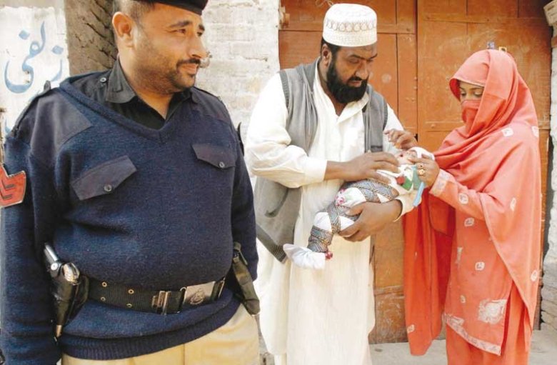 Due to the immense threat to their life, polio workers are now accompanied by police officials in the field. PHOTOS BY HAMID HUSSAIN
