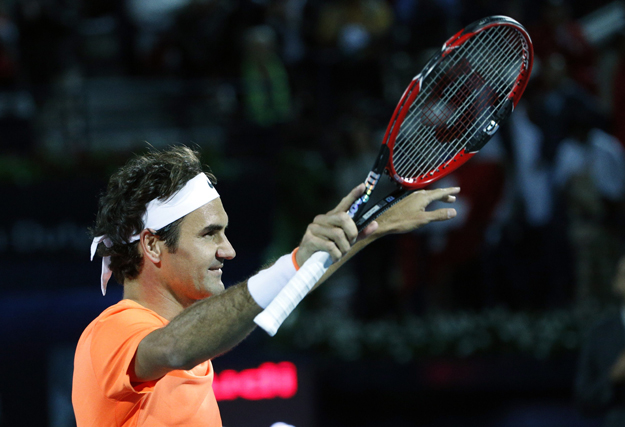 Roger Federer of Switzerland gestures to the crowd after defeating World number one Novak Djokovic of Serbia during their final match on the fifth day of the ATP Dubai Duty Free Tennis Championships on February 28, 2015 in Dubai. PHOTO: AFP