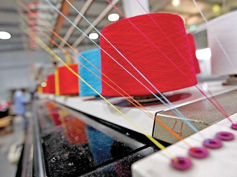 Federal government has withheld the notifications of initiatives under the Textile Policy 2014-19, says APTMA chairman PHOTO: REUTERS