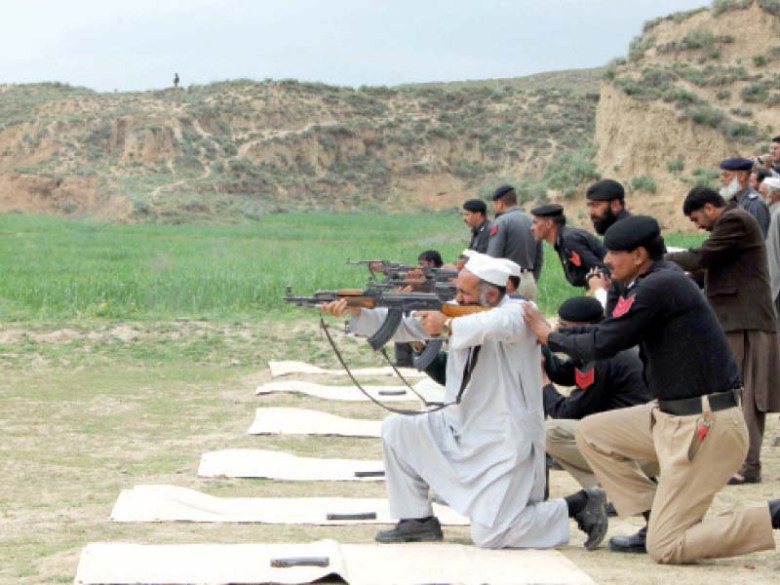 Watchmen receive arms training from police officials in Swat. PHOTO: FAZAL KHALIQ/EXPRESS