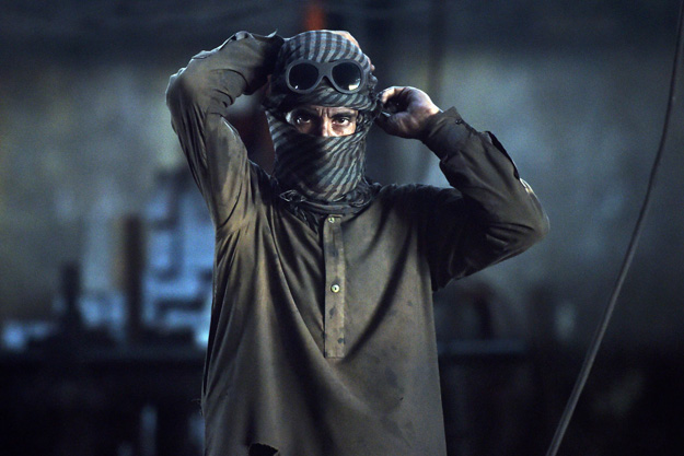 Pakistani labourers work at an iron factory in Karachi on April 30, 2015, on the eve of International Labour Day. PHOTO: AFP