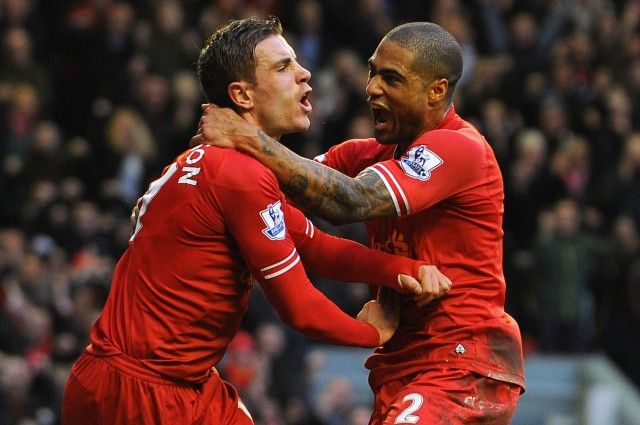 A file photo of Glen Johnson (R) and Jordan Henderson (L) celebrating a goal. PHOTO: AFP