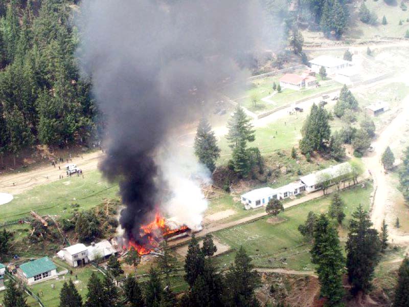 Smoke and flames rise from the site of the helicopter crash in Naltar, Gilgit. PHOTO: MAHA MUSSADAQ/EXPRESS