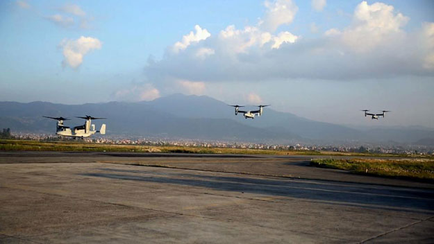 This May 3, 2015 US Marine Corps handout photo shows Marine V-22 Ospreys flying into Tribhuvan International Airport in Kathmandu, Nepal. PHOTO: AFP