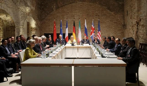 Negotiators of Iran and six world powers face each other at a table in the historic basement of Palais Coburg hotel in Vienna April 24, 2015. PHOTO: REUTERS