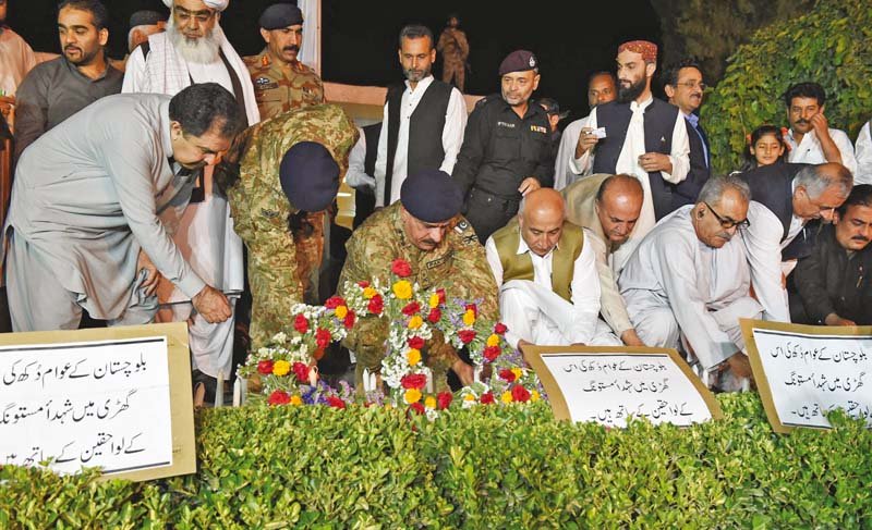Balochistan CM Abdul Malik Baloch, Commander Southern Command Lt-Gen Nasser Khan Janjua light candles at a ceremony to pay their respects to the attack victims in Mastung. PHOTO: EXPRESS/BANARAS KHAN