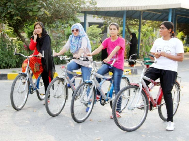 A group of girls prepare for their first bicycle ride on the campus. PHOTO: SHAMSUL ISLAM/EXPRESS
