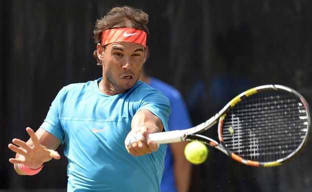 Spain's Rafael Nadal returns the ball to Serbia's Viktor Troicki during the final match at the ATP Mercedes Cup tennis tournament in Stuttgart, southern Germany, on June 14, 2015.     PHOTO: AFP