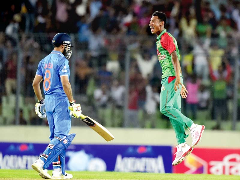 Mustafizur jumps in the air after dismissing Ravindra Jadeja on his way to a six-wicket haul. PHOTO: AFP