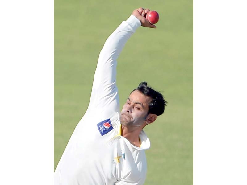 Hafeez is in danger of being slapped with a one-year ban if he does not clear his action in the test within the next 14 days. PHOTO: AFP