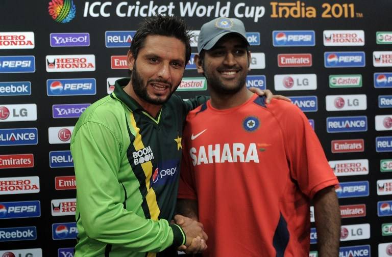 A file photo of Shahid Afridi and MS Dhoni shaking hands at the ICC Cricket World Cup 2011. PHOTO: FILE/AFP