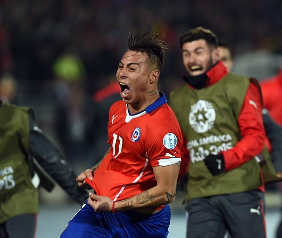 Chile's forward Eduardo Vargas celebrates after scoring the second goal against Peru during their 2015 Copa America football championship semi-final match, in Santiago, on June 29, 2015. PHOTO: AFP